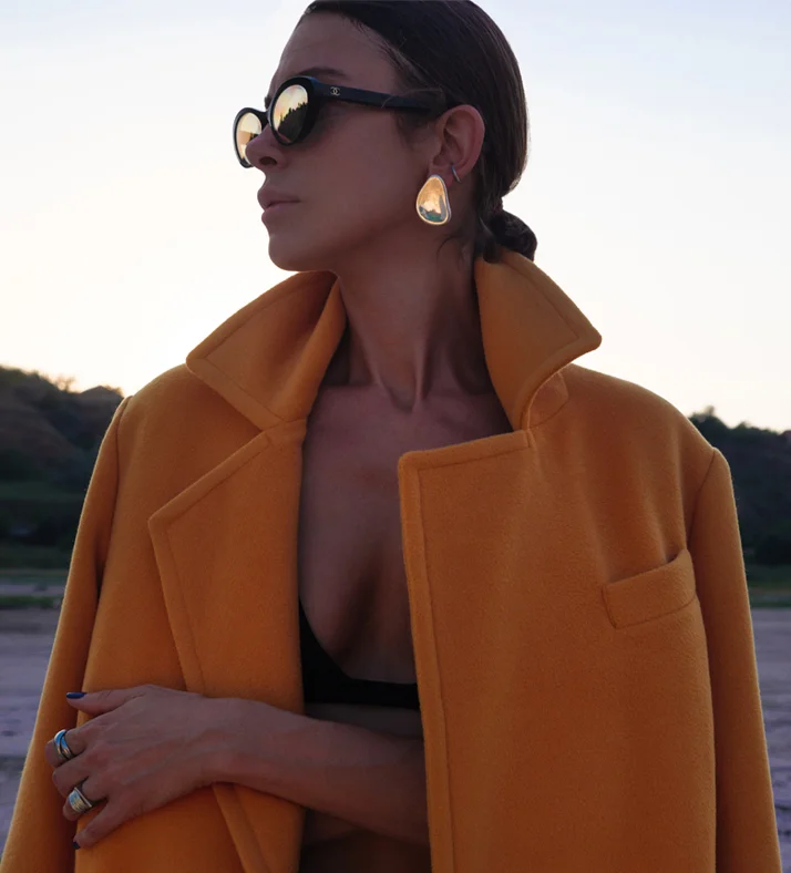 Woman in orange jacket | Plastic Surgery Scottsdale | breast reduction