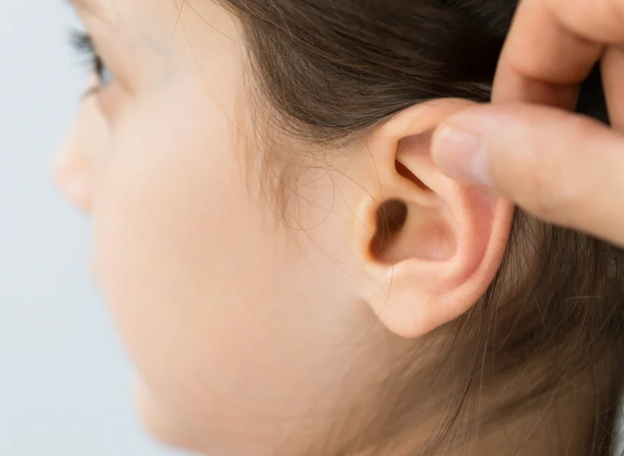 touching ear | Plastic Surgery Scottsdale
